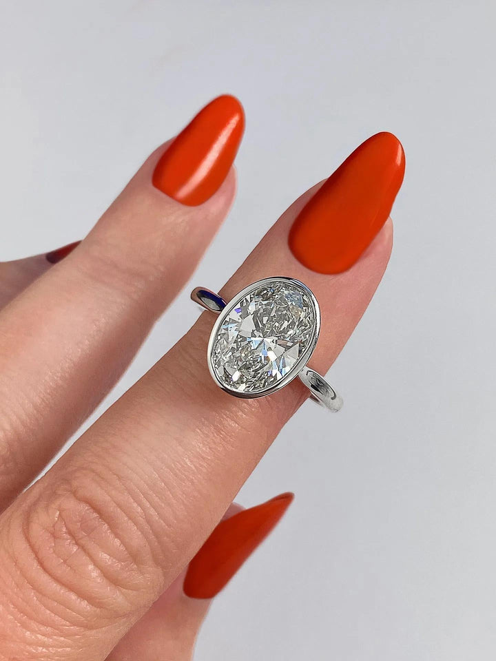 Side angle of oval bezel diamond engagement ring