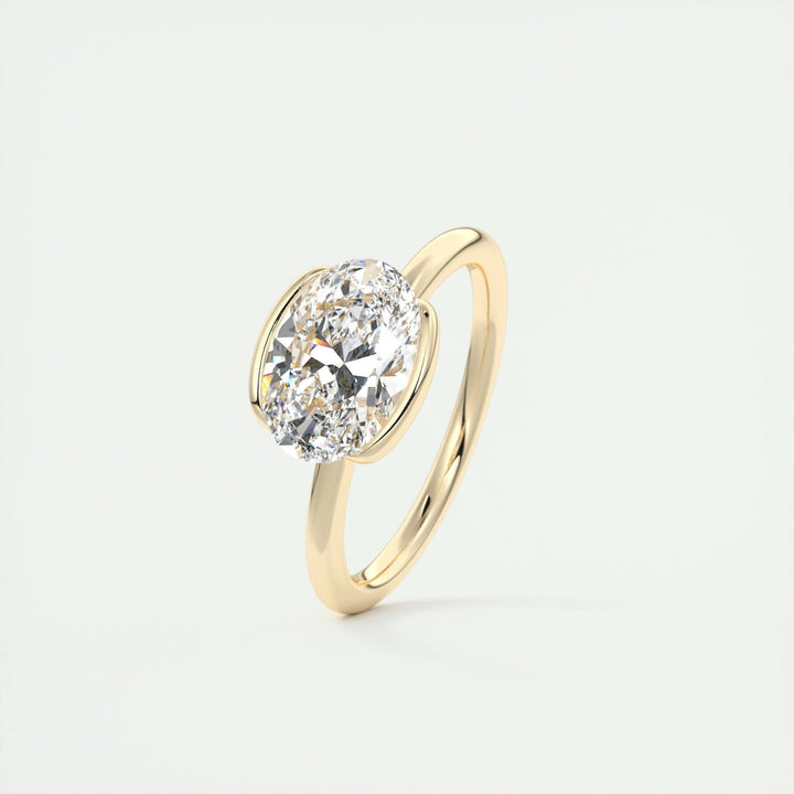 Oval bezel diamond ring presented in signature gift packaging