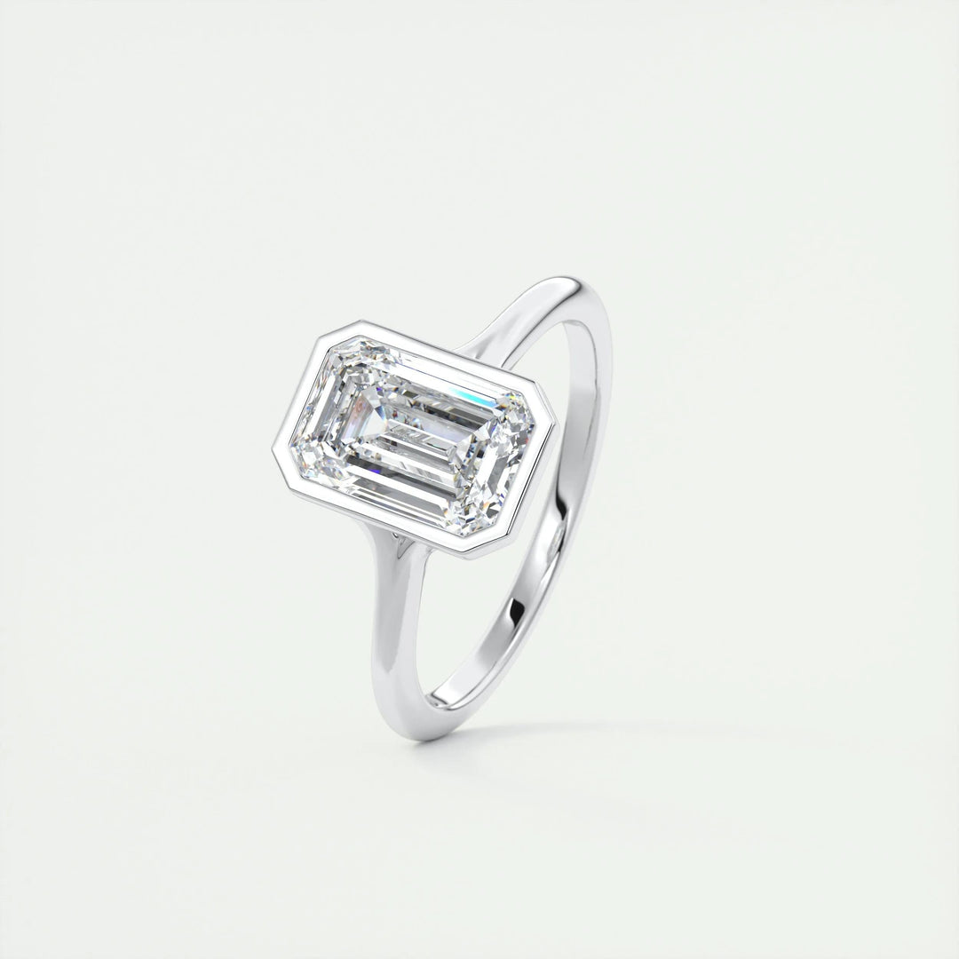 Side angle of emerald bezel diamond engagement ring