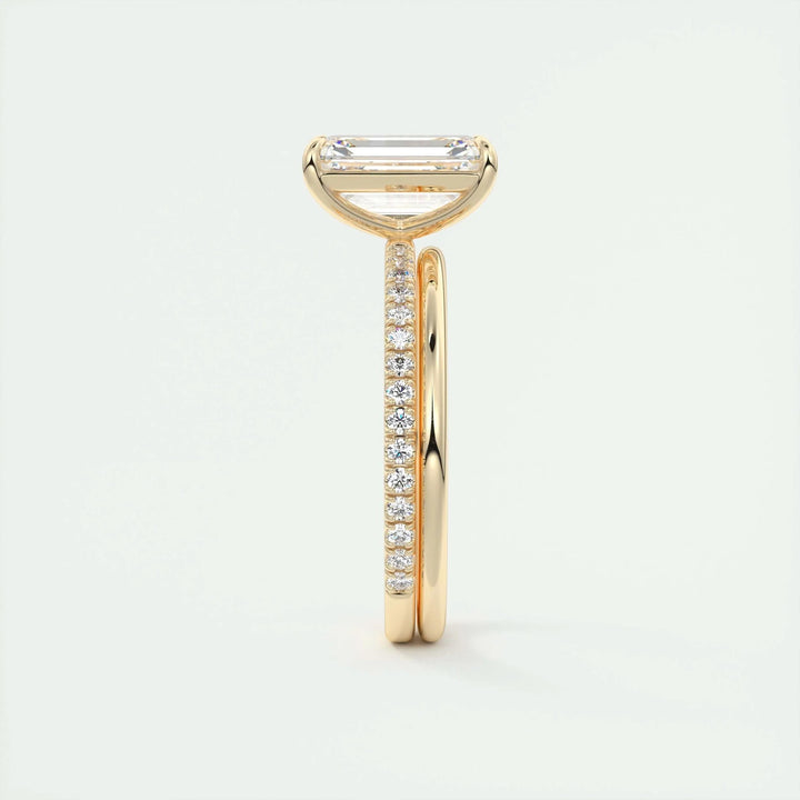 Emerald pave diamond ring displayed on jewelry stand