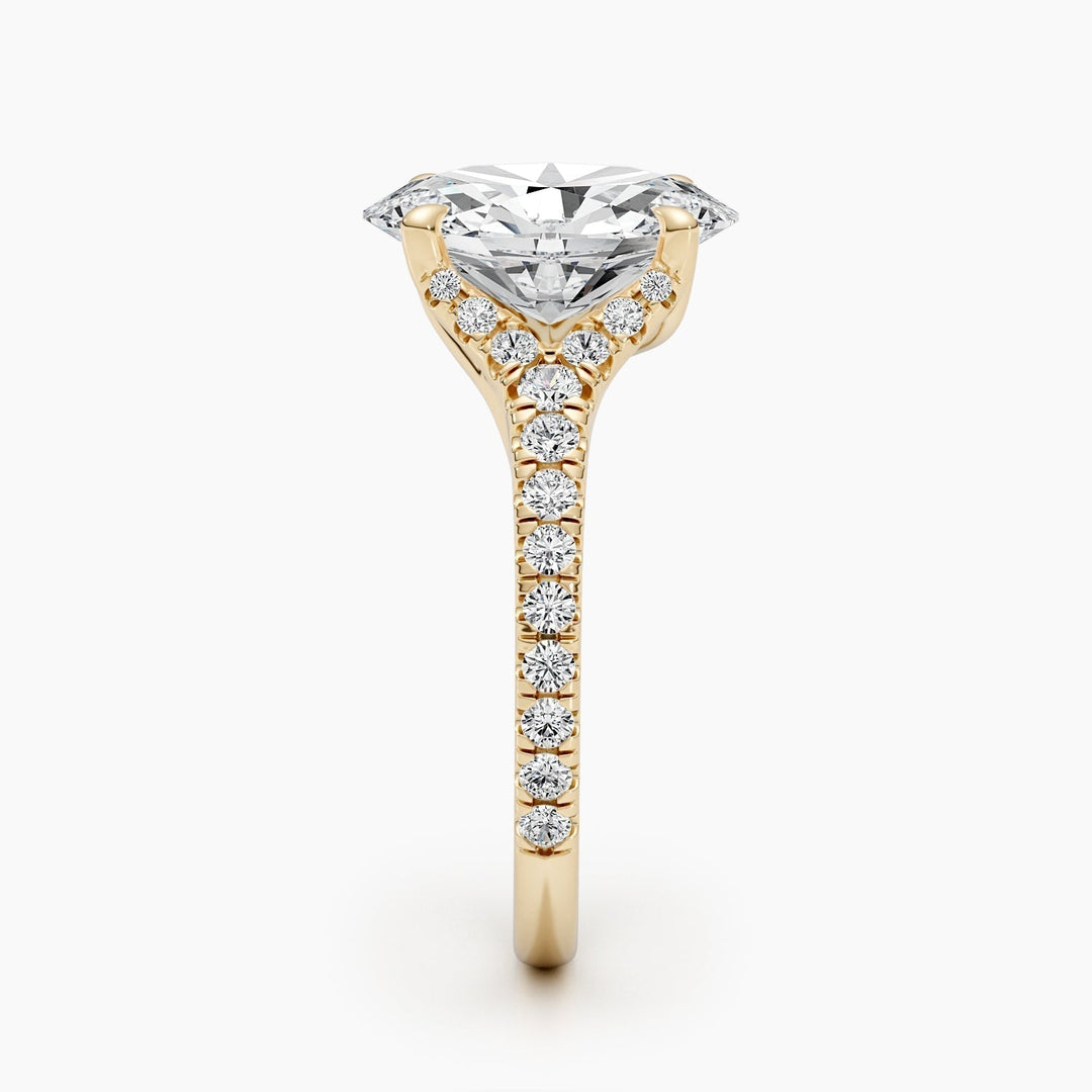 Oval cluster diamond ring displayed on jewelry stand