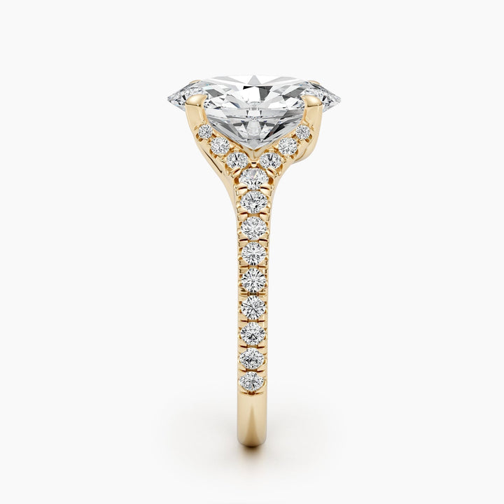 Oval cluster diamond ring displayed on jewelry stand