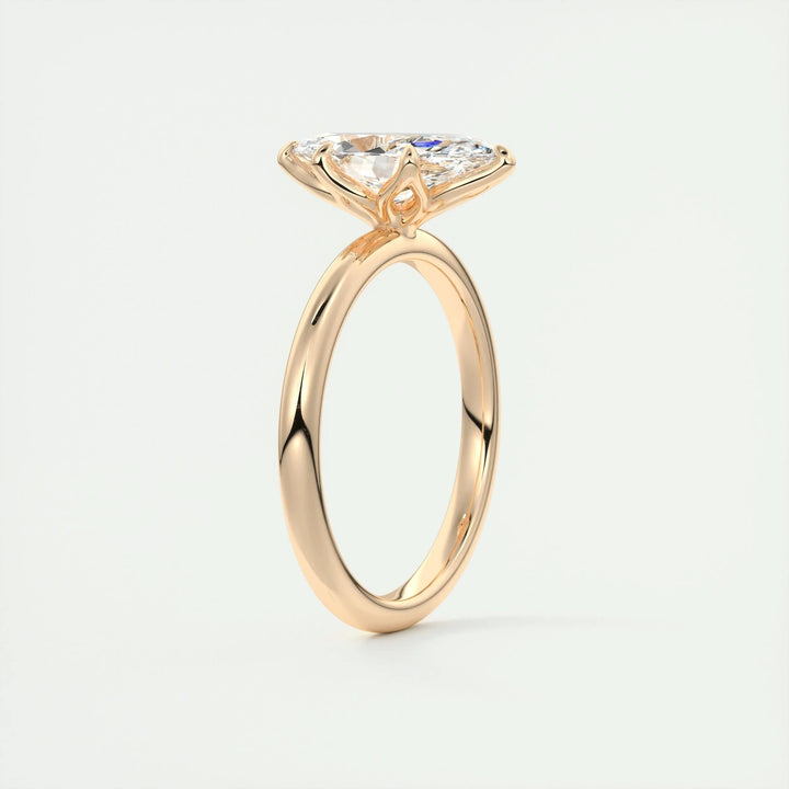 Marquise solitaire engagement ring shown on hand for true-to-life sizing