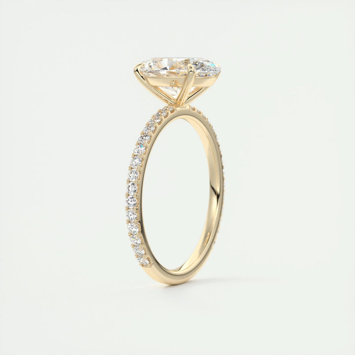 Oval cut pave engagement ring shown in real-life wear
