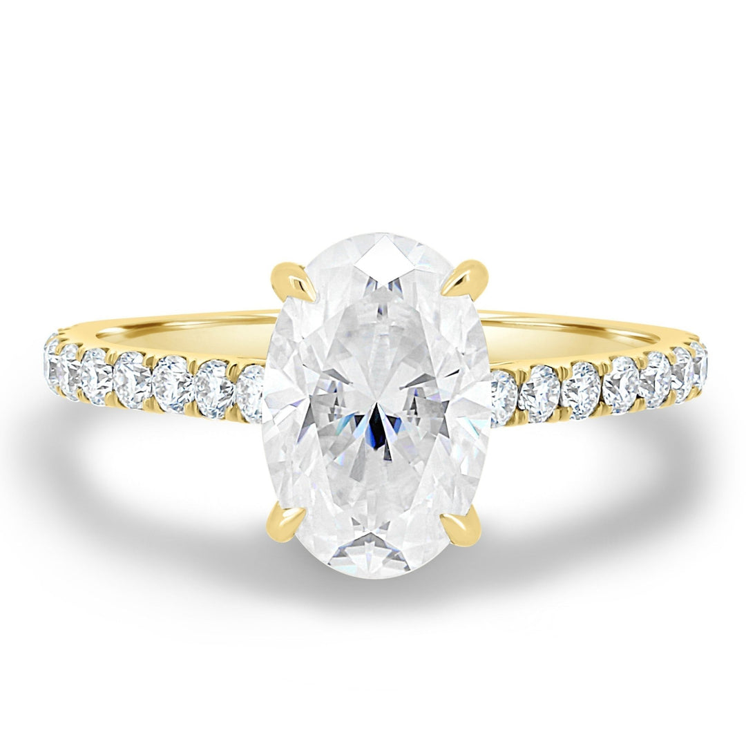 Oval hidden halo engagement ring close-up showing F/VS2 diamond clarity