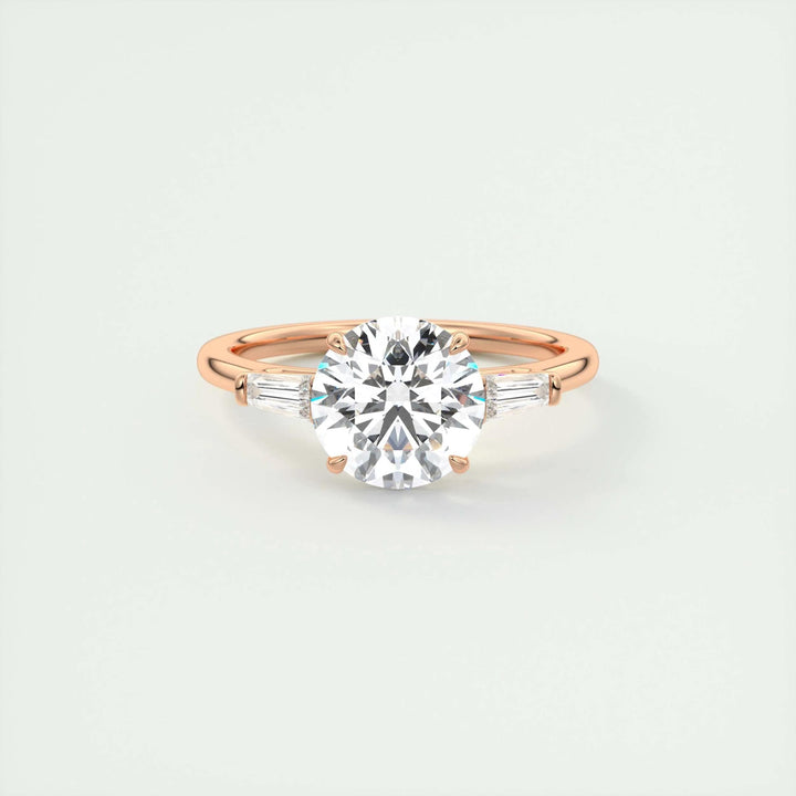 Close-up of round cut center diamond in three stone engagement ring