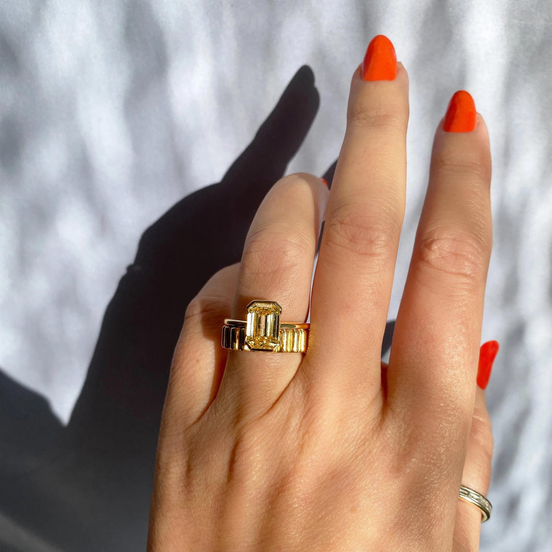 Certified emerald cut diamond featured in solitaire engagement ring