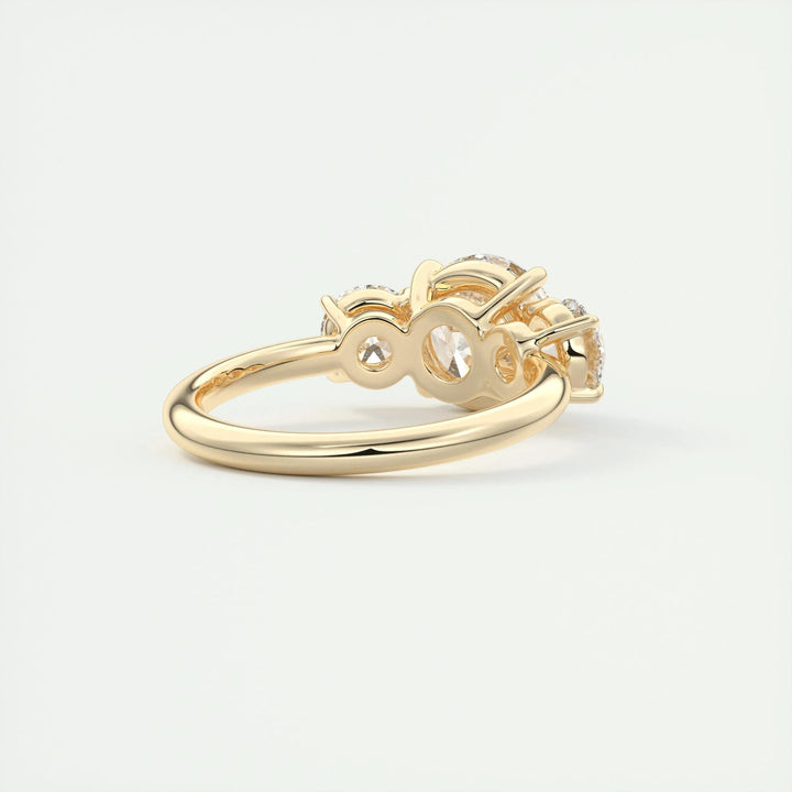 Round three stone engagement ring photographed in natural light