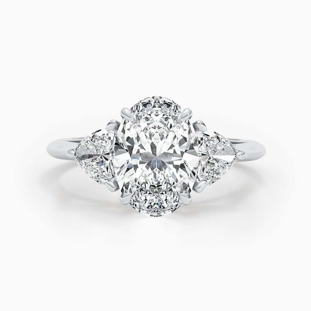 Oval cut three stone engagement ring shown in real-life wear