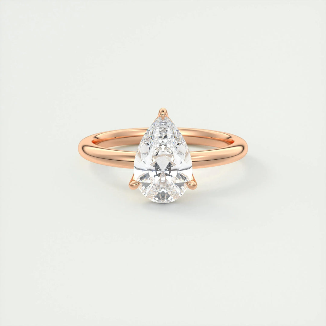 Macro shot of pear cut diamond facets in solitaire ring setting