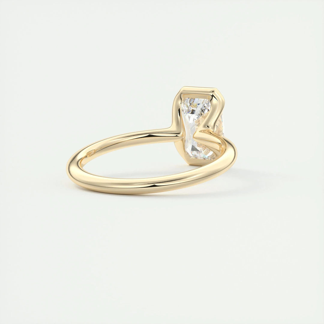 Emerald solitaire engagement ring close-up showing F-/VS1 diamond clarity