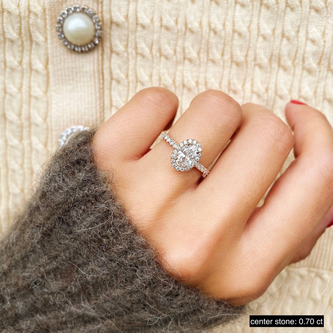 Top-down view of oval cut pave engagement ring