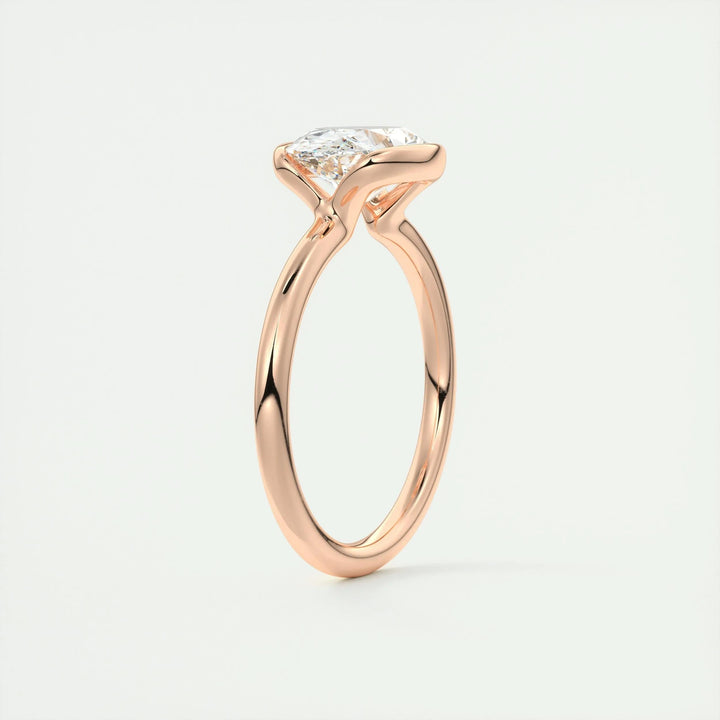 Oval bezel engagement ring finished in polished solid gold