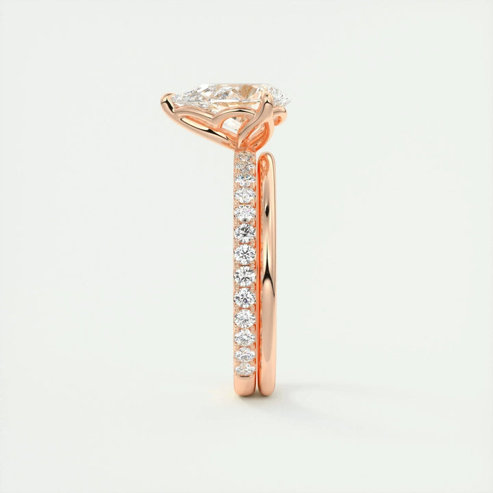 Close-up of pear cut center diamond in pave engagement ring