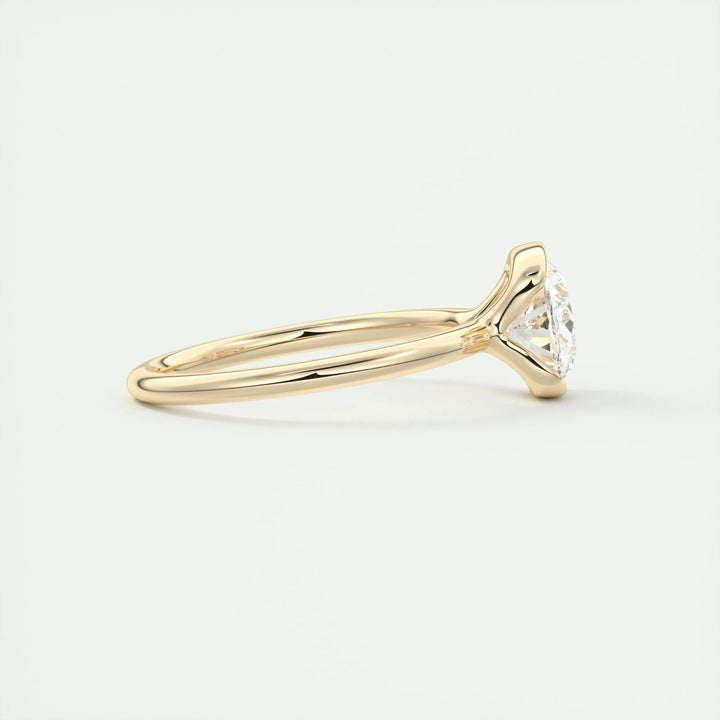 Oval bezel engagement ring offered in gold and platinum
