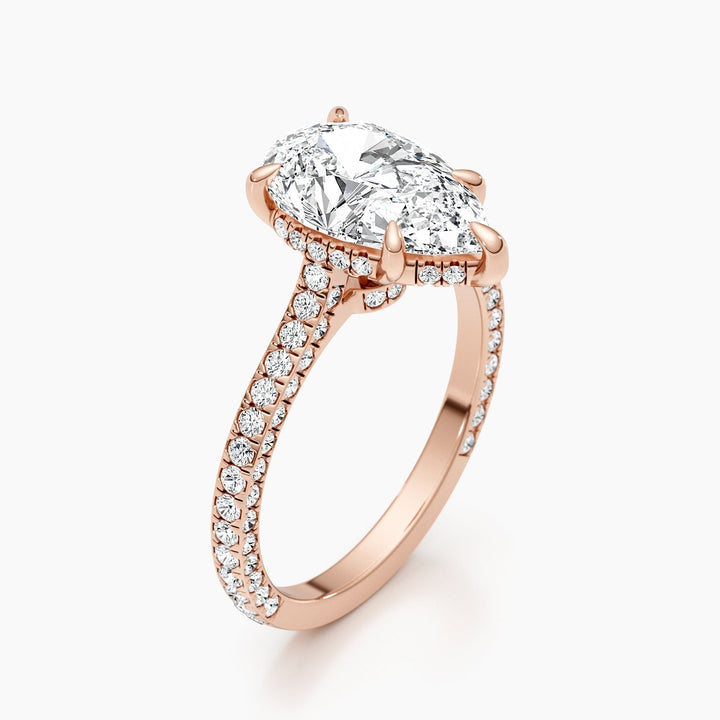 Pear hidden halo lab grown diamond ring fitted on finger