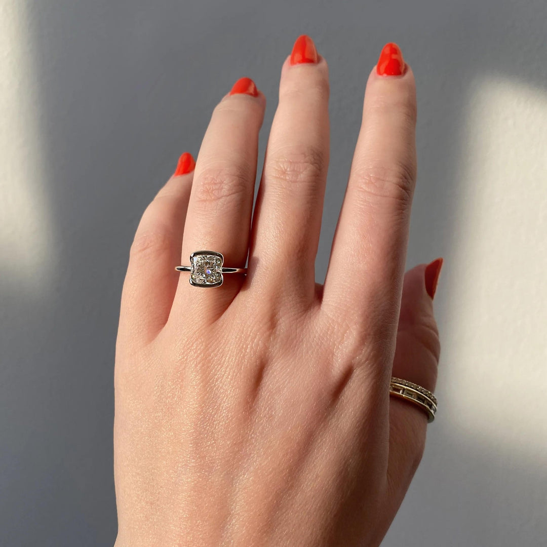 Cushion solitaire lab grown diamond ring fitted on finger