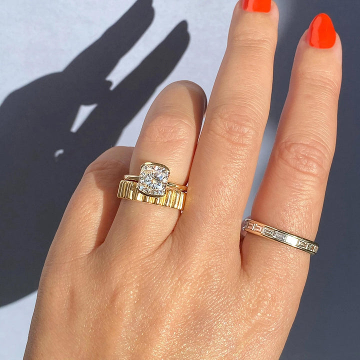 Cushion solitaire engagement ring shown on hand for true-to-life sizing