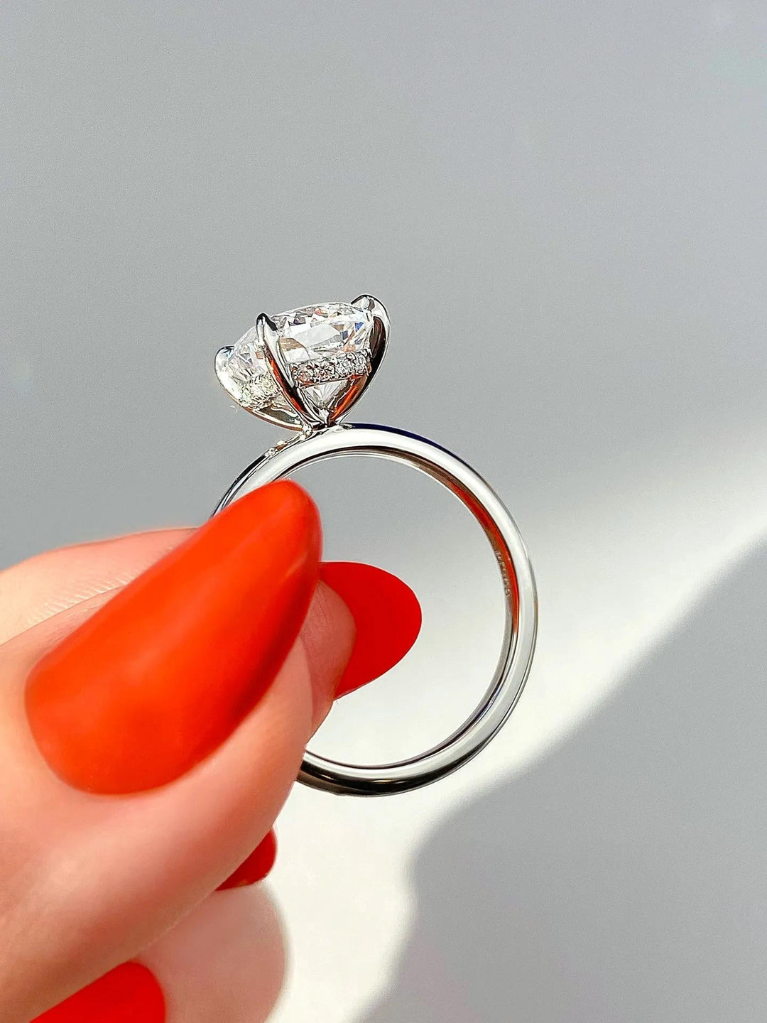 Close-up of cushion cut center diamond in hidden halo engagement ring