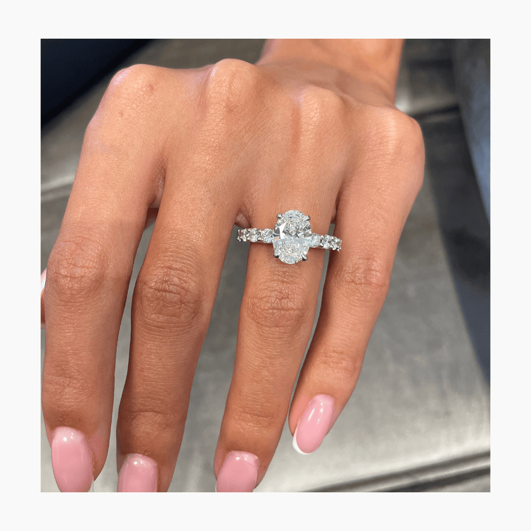 Side angle of oval pave diamond engagement ring