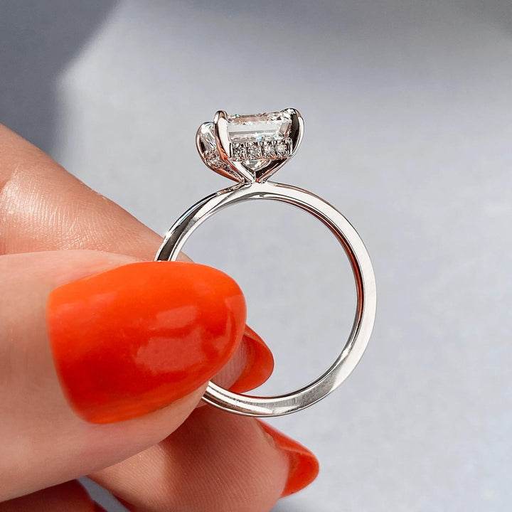 Macro shot of cushion cut diamond facets in hidden halo ring setting