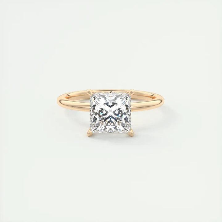 Princess hidden halo engagement ring offered in gold and platinum