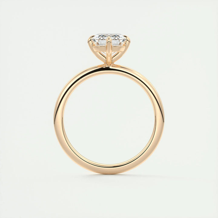 Emerald solitaire engagement ring shown on hand for true-to-life sizing