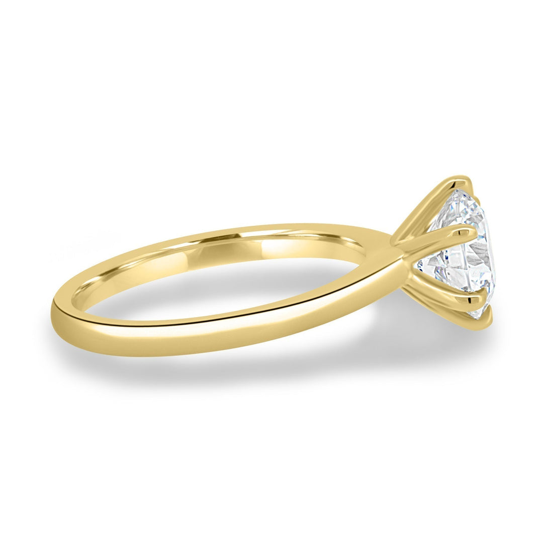 Round solitaire diamond engagement ring available in multiple metals