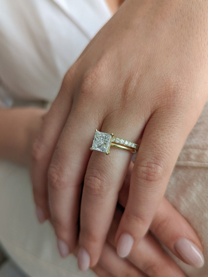 Princess cut diamond ring worn on hand