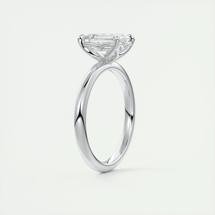 Side angle of emerald solitaire diamond engagement ring