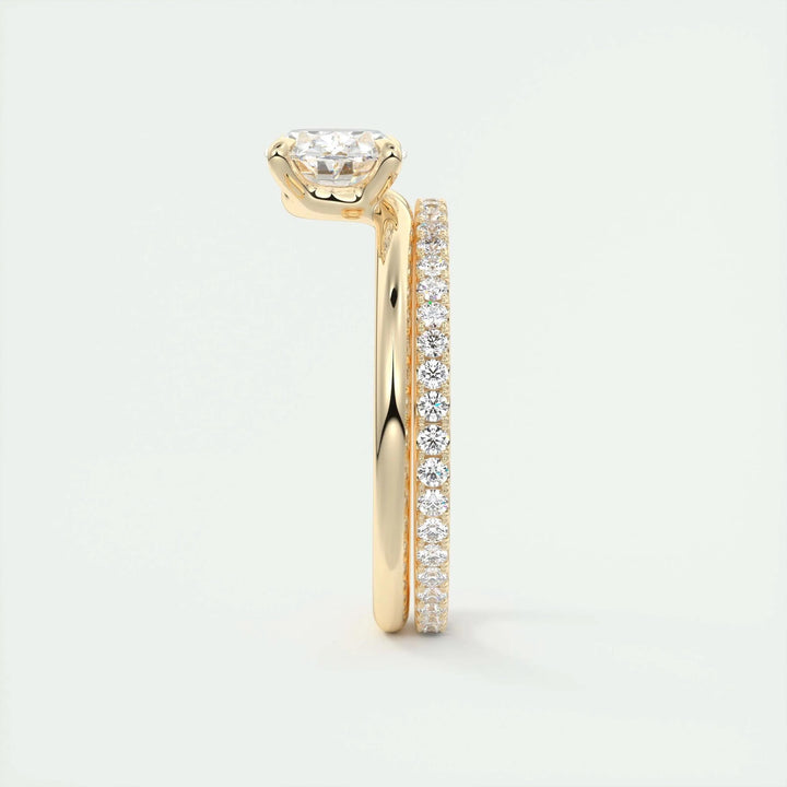 Close-up of oval cut center diamond in east west engagement ring