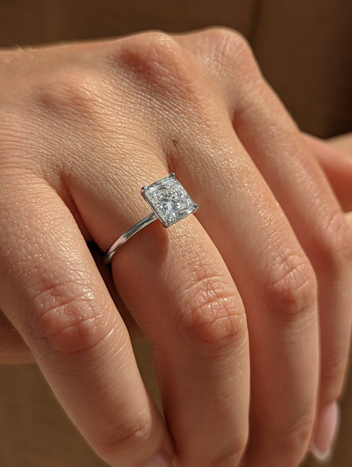 Cushion solitaire engagement ring with brilliant diamond sparkle