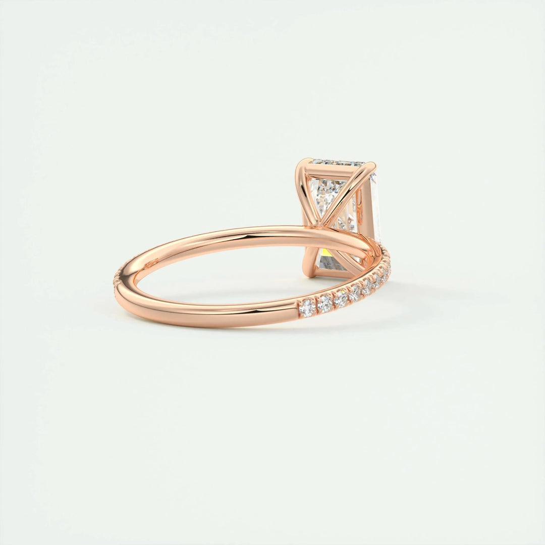 Close-up of emerald cut center diamond in pave engagement ring
