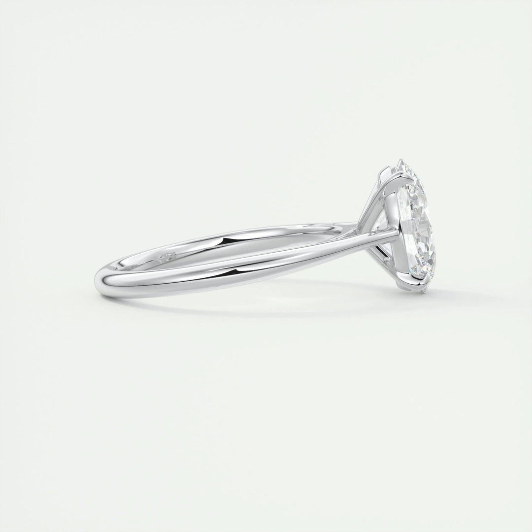 Oval solitaire engagement ring close-up showing F-/VS1 diamond clarity