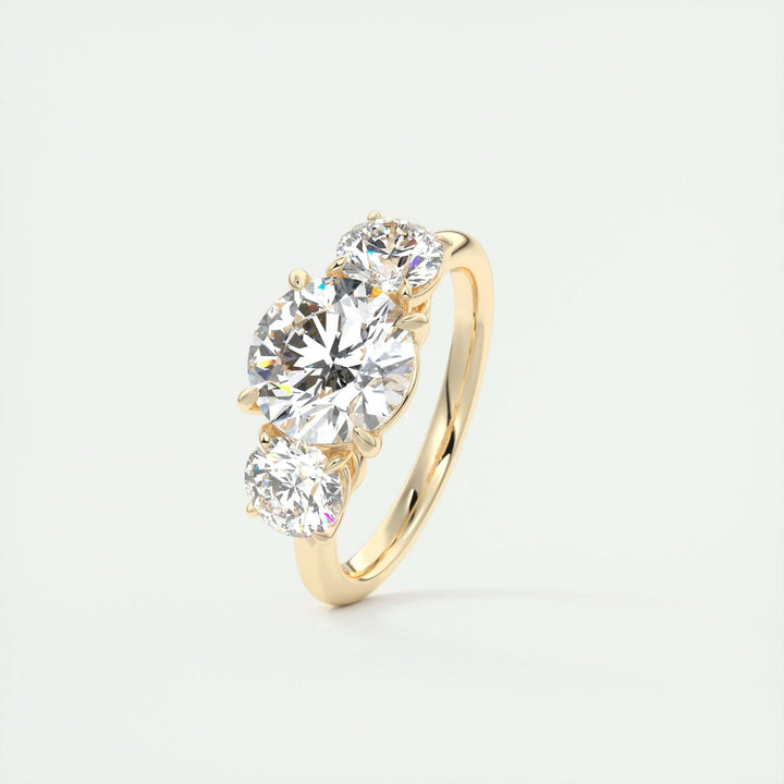 Top-down view of round cut three stone engagement ring