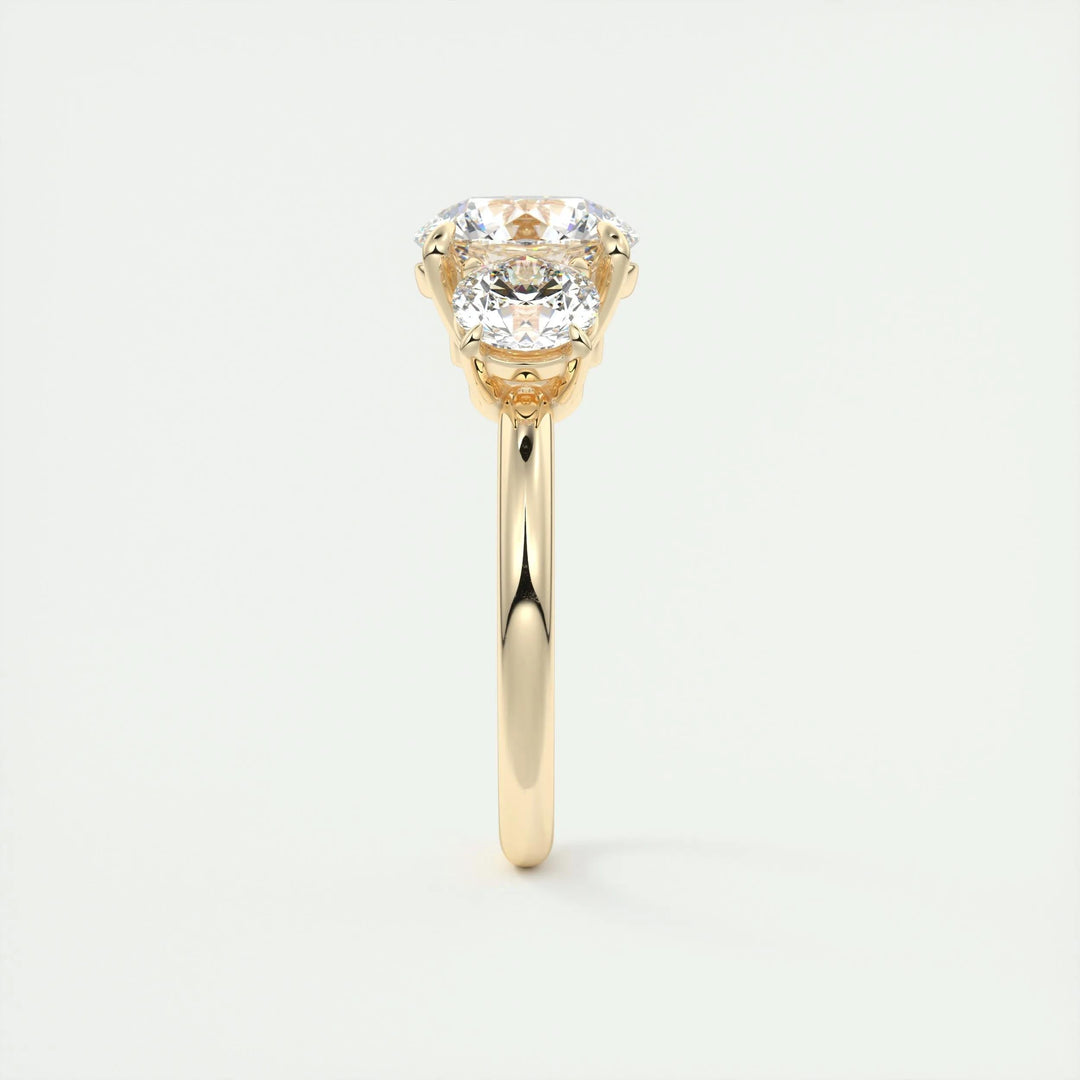 Round three stone diamond ring displayed on jewelry stand
