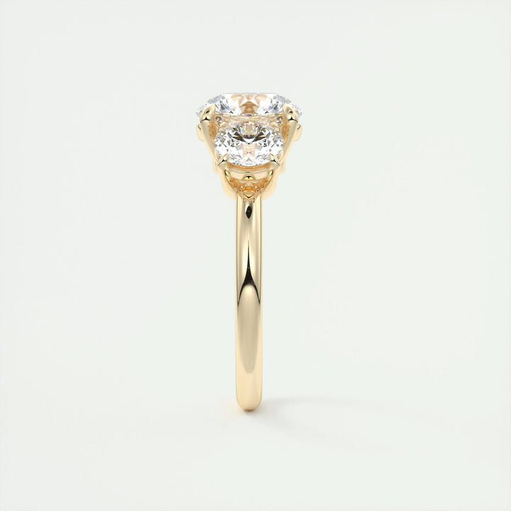 Round three stone diamond ring displayed on jewelry stand