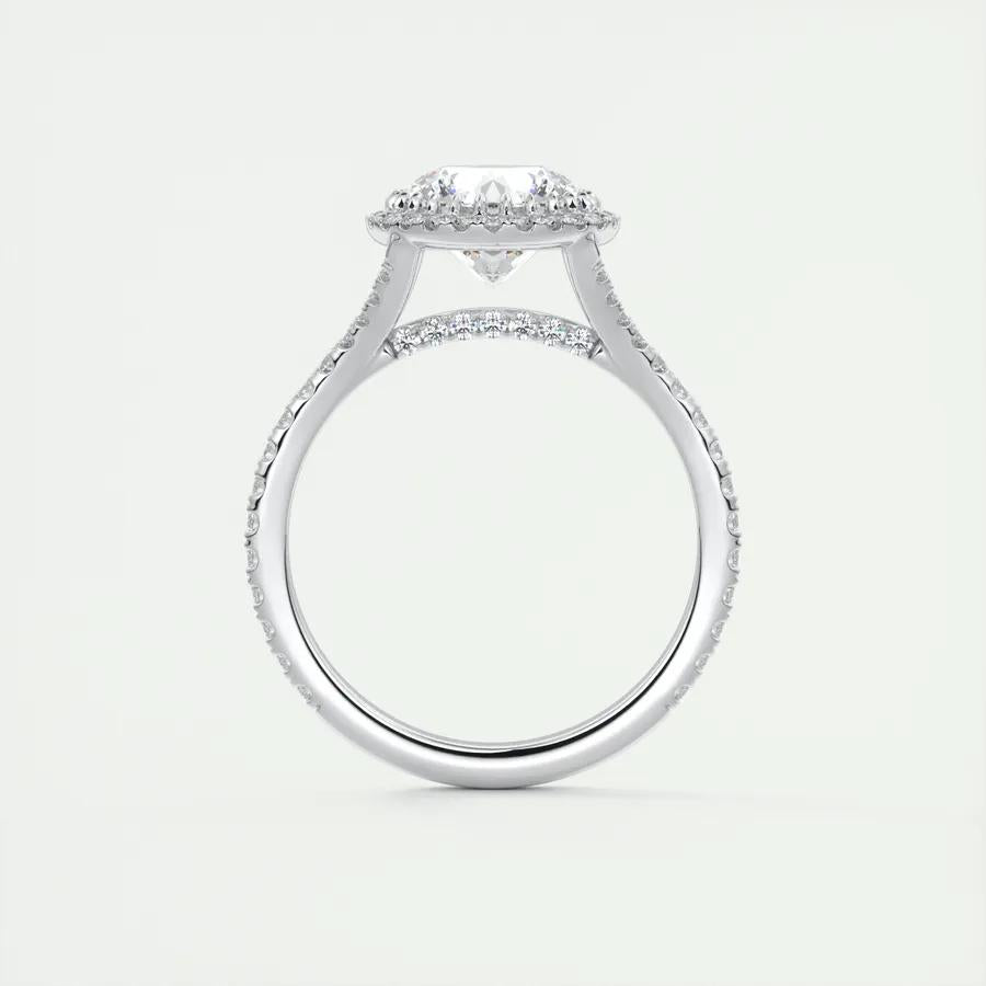 Round halo diamond ring displayed on jewelry stand