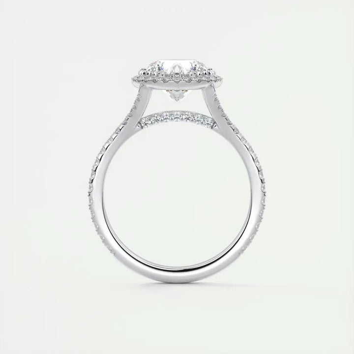 Round halo diamond ring displayed on jewelry stand