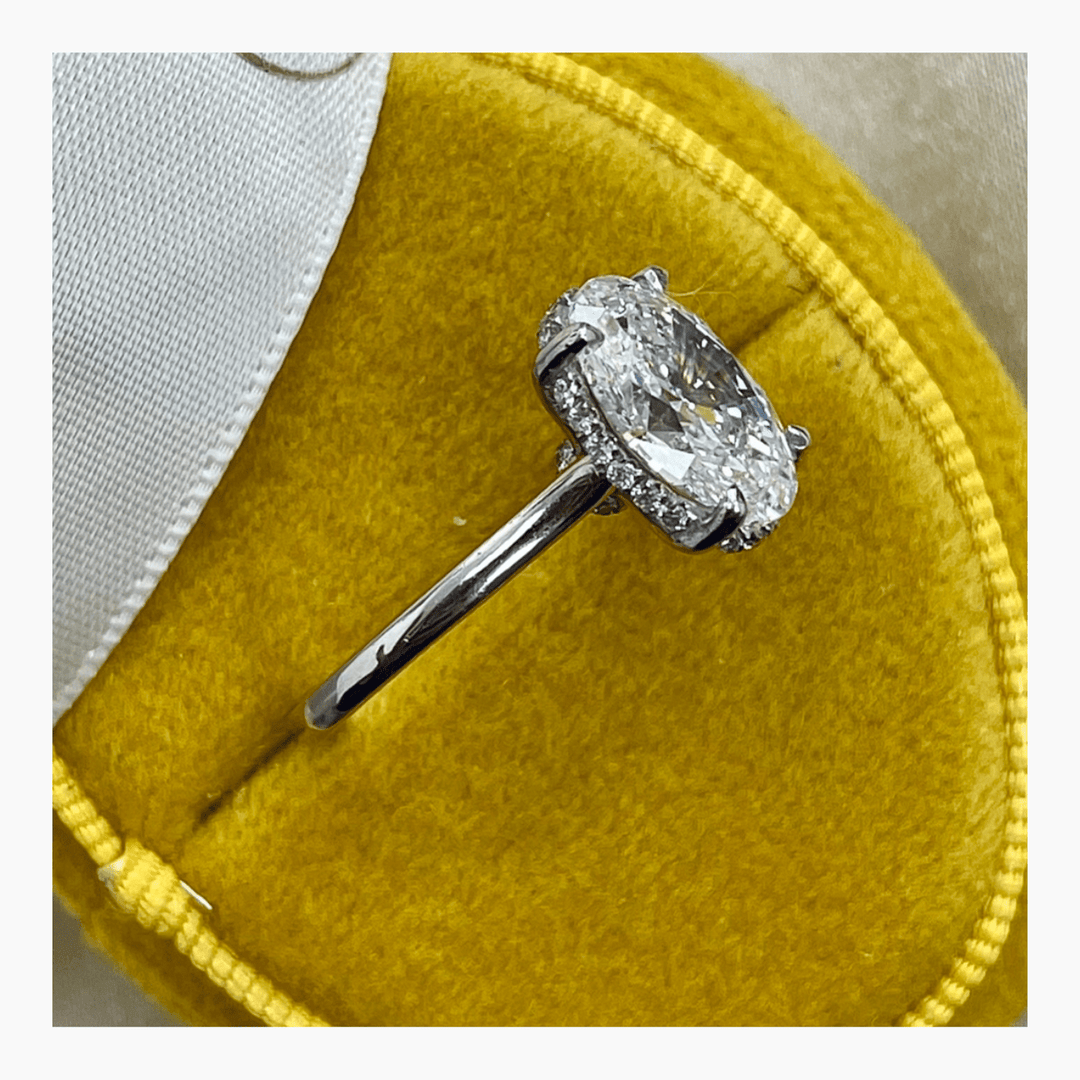 Oval hidden halo engagement ring with brilliant diamond sparkle