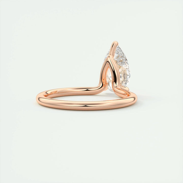 Pear solitaire engagement ring viewed from the side