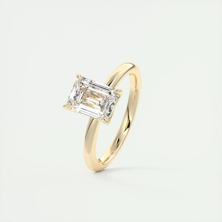 Emerald solitaire lab grown diamond ring fitted on finger