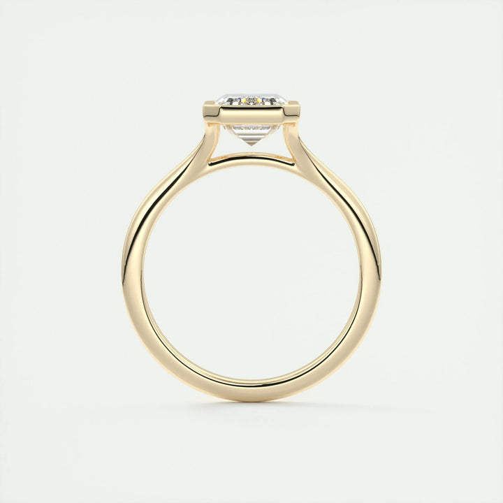 Emerald bezel engagement ring with certified lab grown diamond