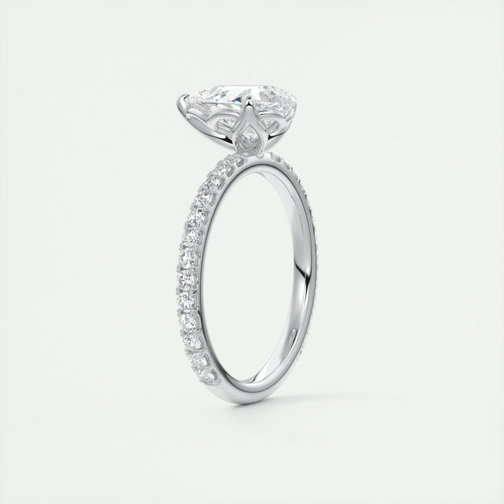 Unboxing view of pear cut pave diamond engagement ring