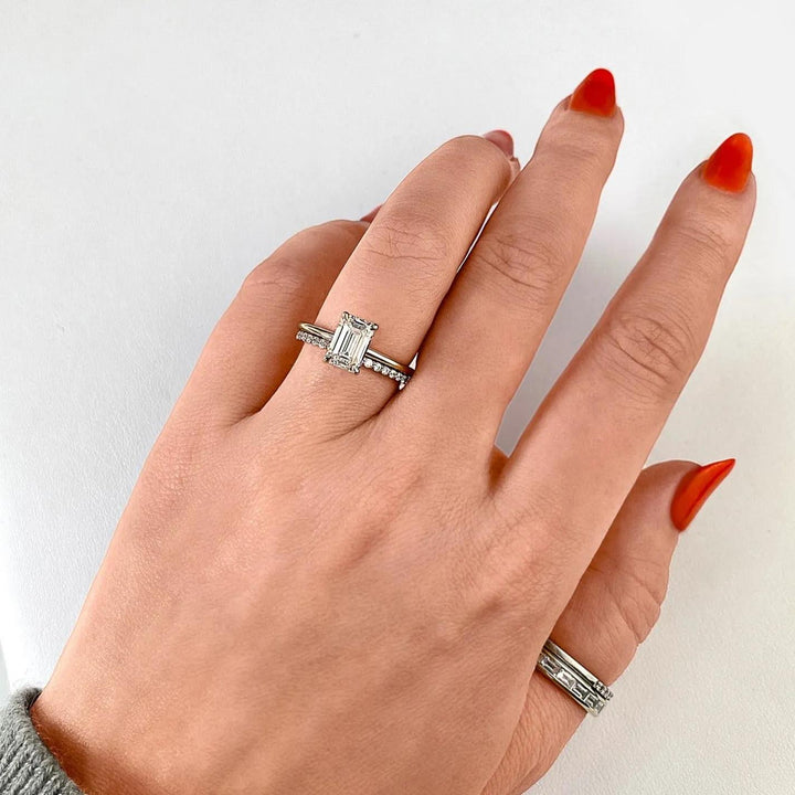 Emerald solitaire diamond engagement ring available in multiple metals