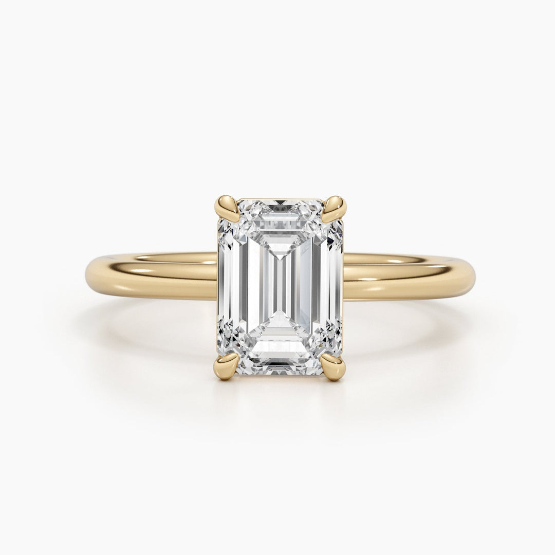 Emerald solitaire lab grown diamond ring side profile in gold setting