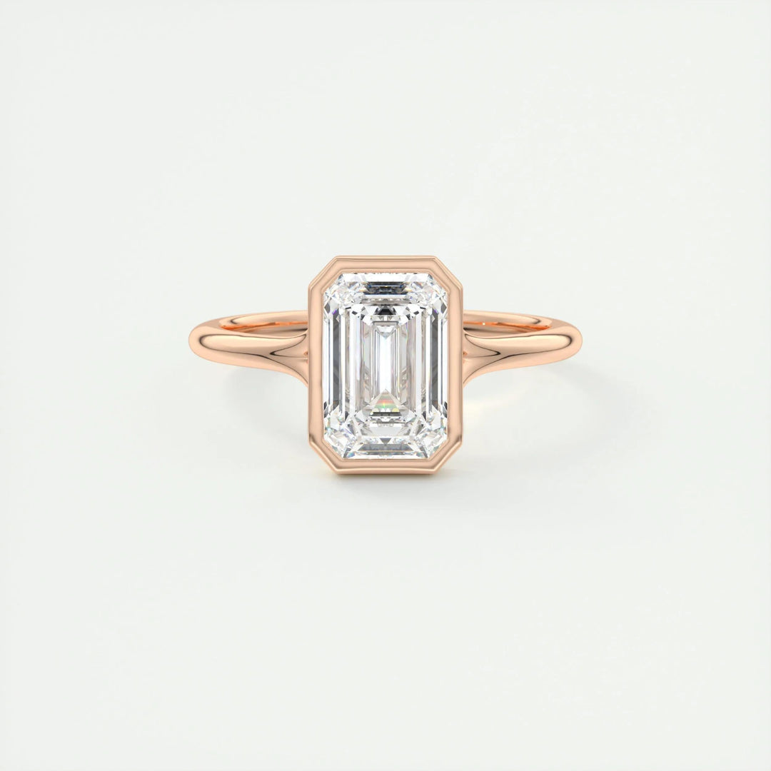 Certified emerald cut diamond featured in bezel engagement ring