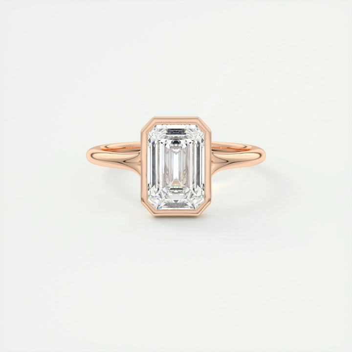 Certified emerald cut diamond featured in bezel engagement ring