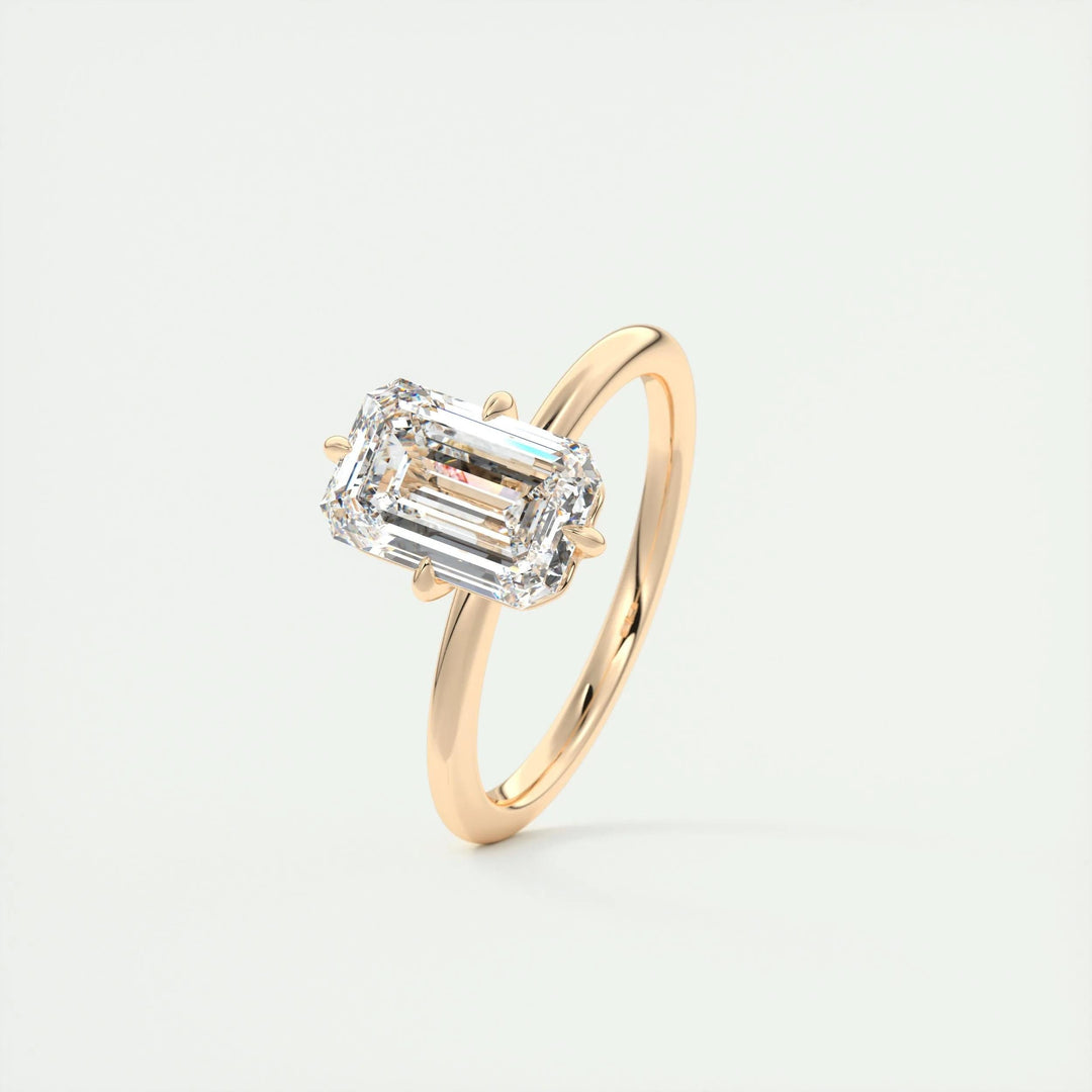 Side angle of emerald solitaire diamond engagement ring