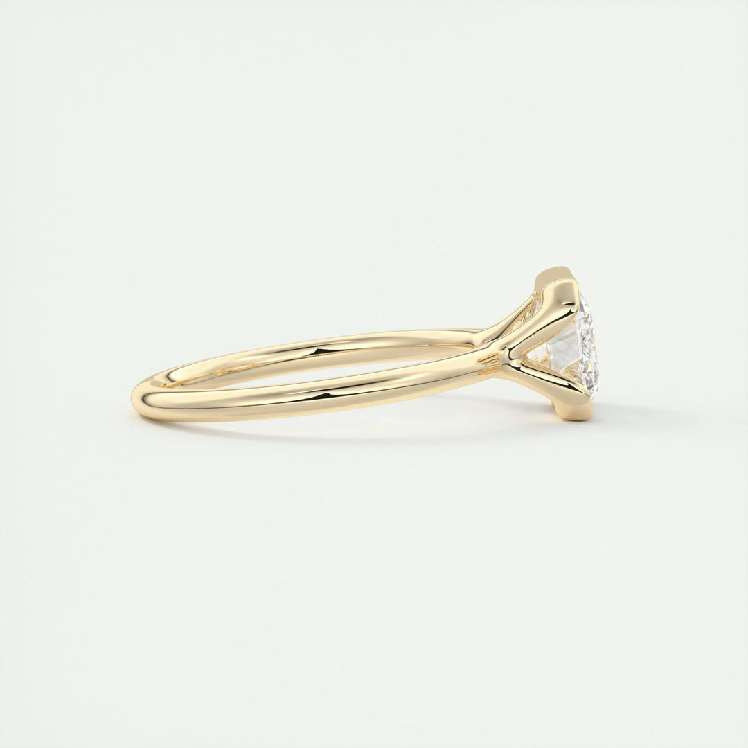 Fine craftsmanship detail on emerald solitaire engagement ring